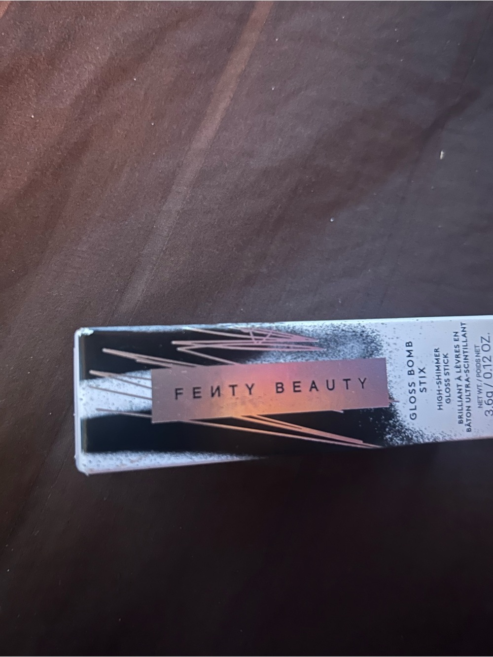Fenty Beauty Gloss Bomb Lip Luminizer in shade Fenty Glow, Rose Gold Shimmer